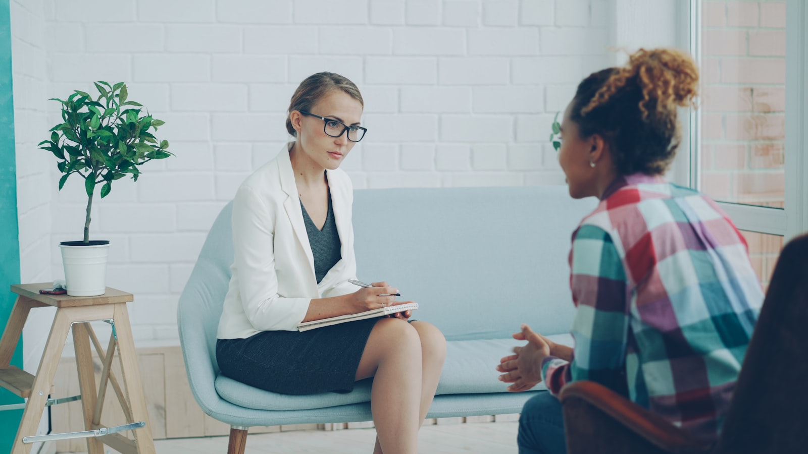 Two women talking during a supportive counselling and therapy session