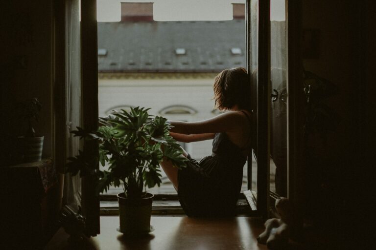 Woman reflecting on unresolved childhood trauma that resurfaces in marriage