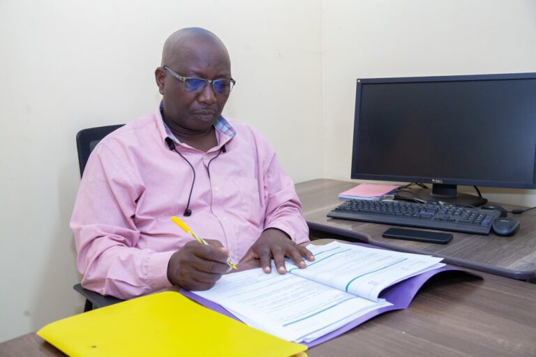 Primrose Rehab and Wellness clinician reviewing case notes at the Thindigua centre