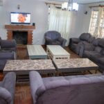 Communal living area with television at Primrose Rehab and Wellness residential rehab